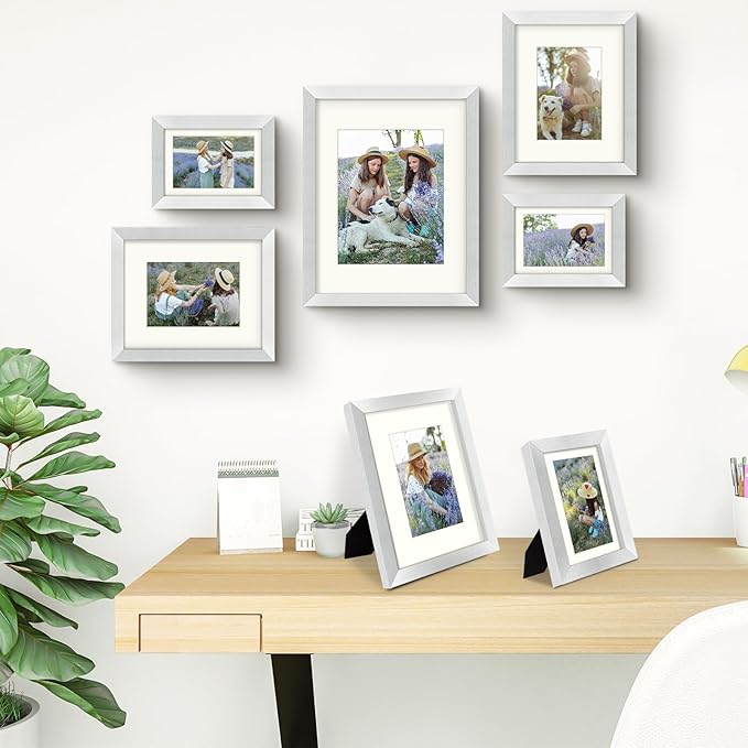 Frametory, Gallery Wall Frame Set of 7 Multiple Sizes 11x14, 8x10, 5x7 Picture Frame Collage with Ivory Color Mat for Prints, with Real Glass (Silver)