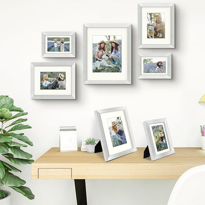 Frametory, Gallery Wall Frame Set of 7 Multiple Sizes 11x14, 8x10, 5x7 Picture Frame Collage with Ivory Color Mat for Prints, with Real Glass (Silver)