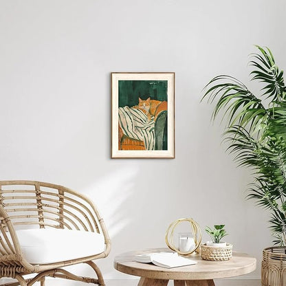 ASTRDECOR Minimalist Framed Wall Art - Cozy Cat Sleeping on Couch with Vintage Green & White Striped Blanket, Trendy Cute Orange Cat Canvas Posters, Modern Aesthetic Bedroom Apartment or Living Room Décor 12x16Inch