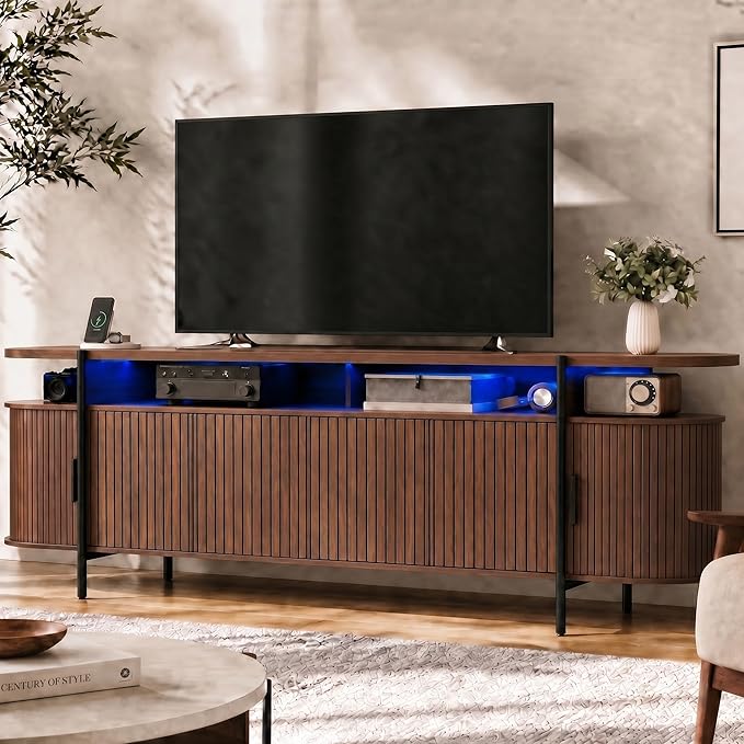 69" Mid Century Modern TV Stand, Curved Entertainment Center with LED Light & Power Outlet, Fluted Wood TV Stand for TVs up to 80'',Media TV Console Table with Sliding Doors for Living Room, Walnut